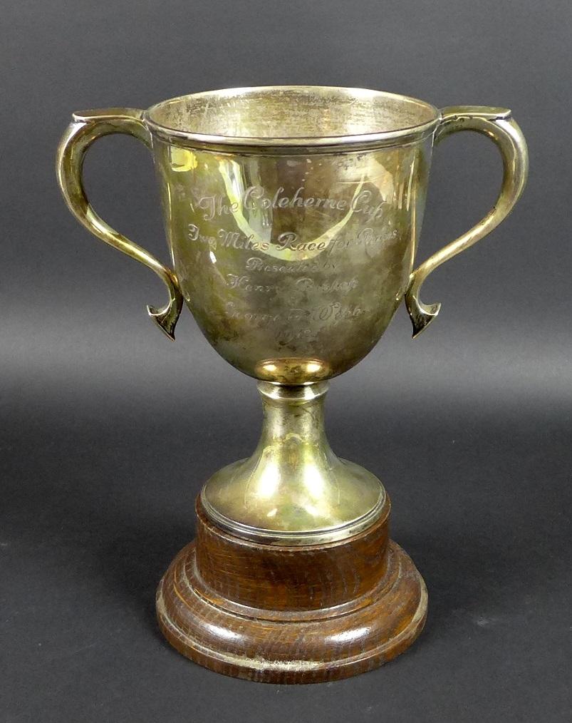 A George V silver twin handled trophy, engraved 'The Coleherne Cup, Two Miles Race for Ponies,