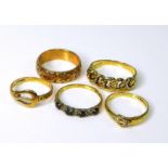 A group of five 9ct gold rings, including two formed as belts, both size I/J, and a band engraved