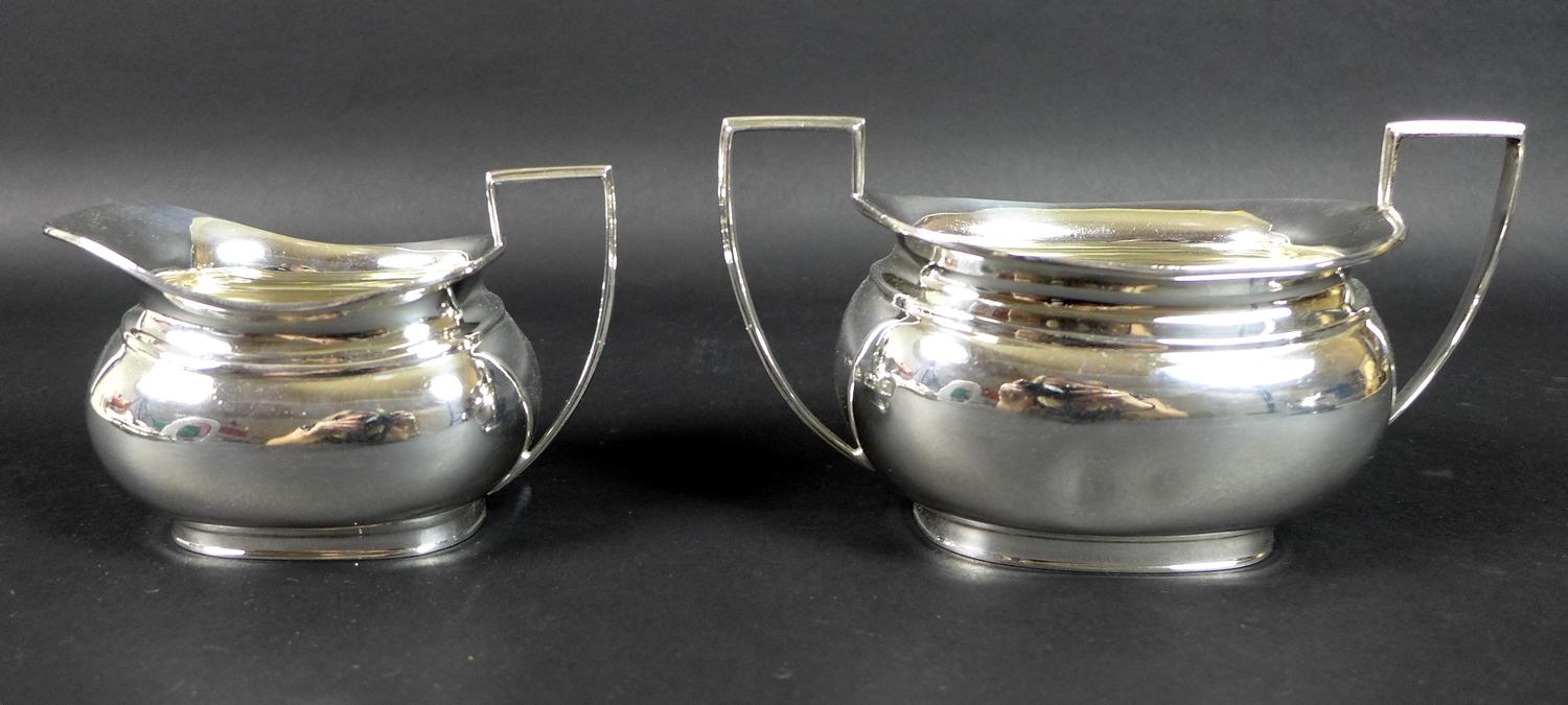 A George V silver three piece tea service, London shape, comprising teapot, twin handled sugar bowl, - Image 7 of 11