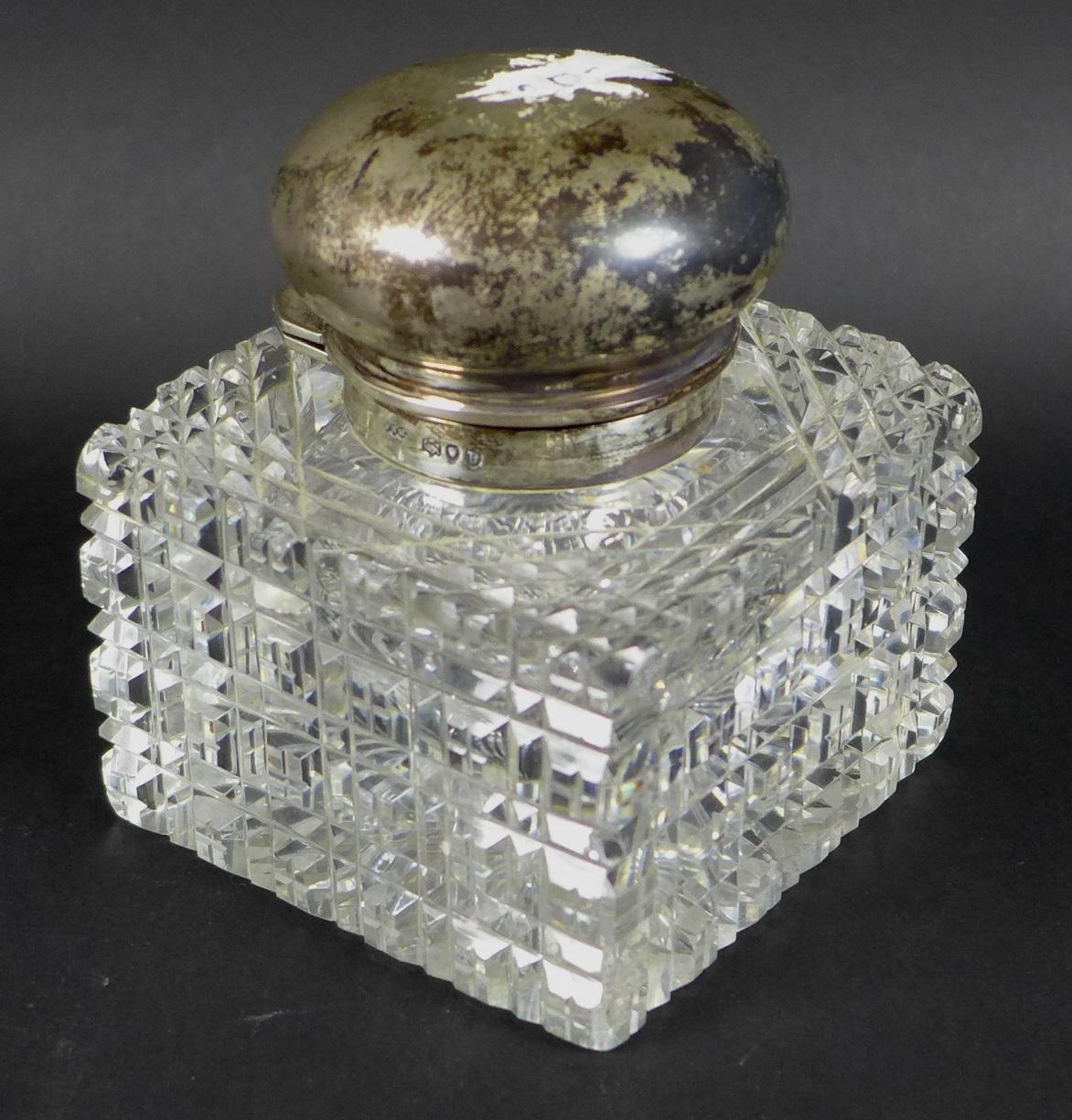 A Victorian silver topped cut glass perfume bottle, by Army & Navy Cooperative Society Ltd, London