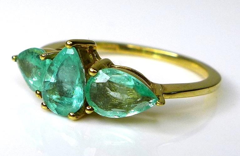 A 9ct gold ring set with three pear cut Siberian emeralds, approx 1.74ct total, limited edition 1 of