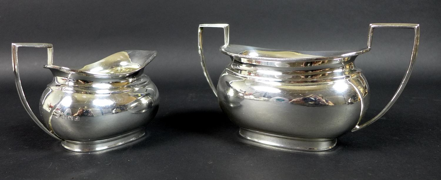 A George V silver three piece tea service, London shape, comprising teapot, twin handled sugar bowl, - Image 8 of 11