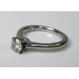 A platinum and diamond solitaire ring, the brilliant cut stone approximately 0.2ct, 4.5 by 4.5mm,