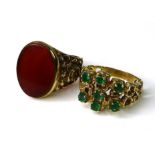Two 9ct gold rings, one a signet ring set with carnelian, raised scroll decoration to shoulders,
