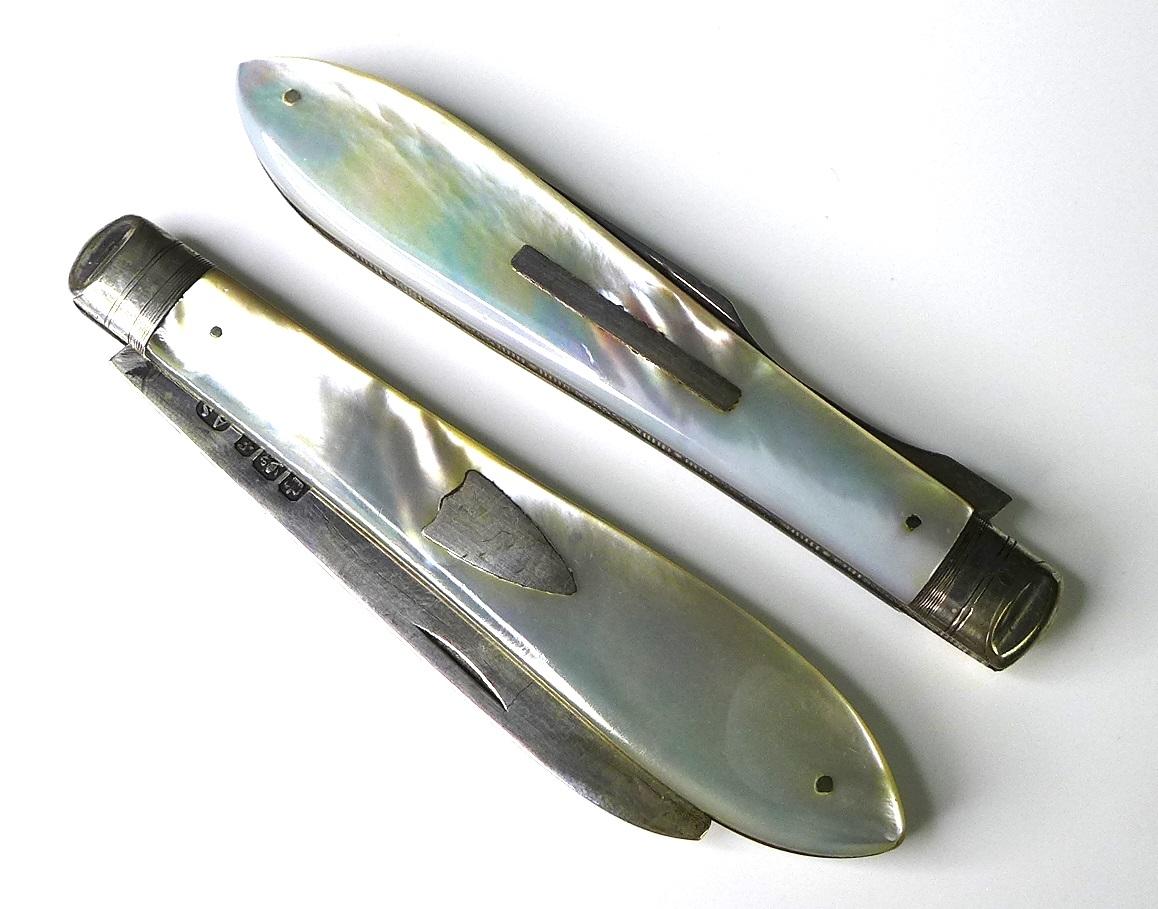 A cased set of folding silver and mother of pearl cutlery, comprising knife and fork.