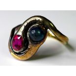 An 18ct gold, Russian ruby and sapphire cabochon ring, in the form of two snakes, size P, 4.7g, with