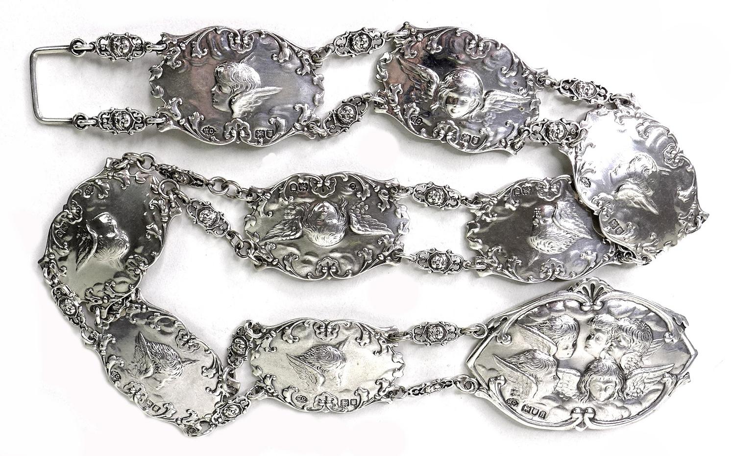 An Edward VII silver christening belt, formed of nine oval plaques each cast in relief with