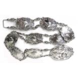 An Edward VII silver christening belt, formed of nine oval plaques each cast in relief with