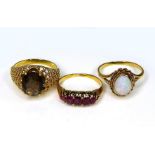 A group of three rings, one set with five oval garnets, unmarked but tests as 14ct gold, size J, 2.