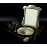 A group of silver and white metal, comprising a silver photograph frame with leather easel back, for