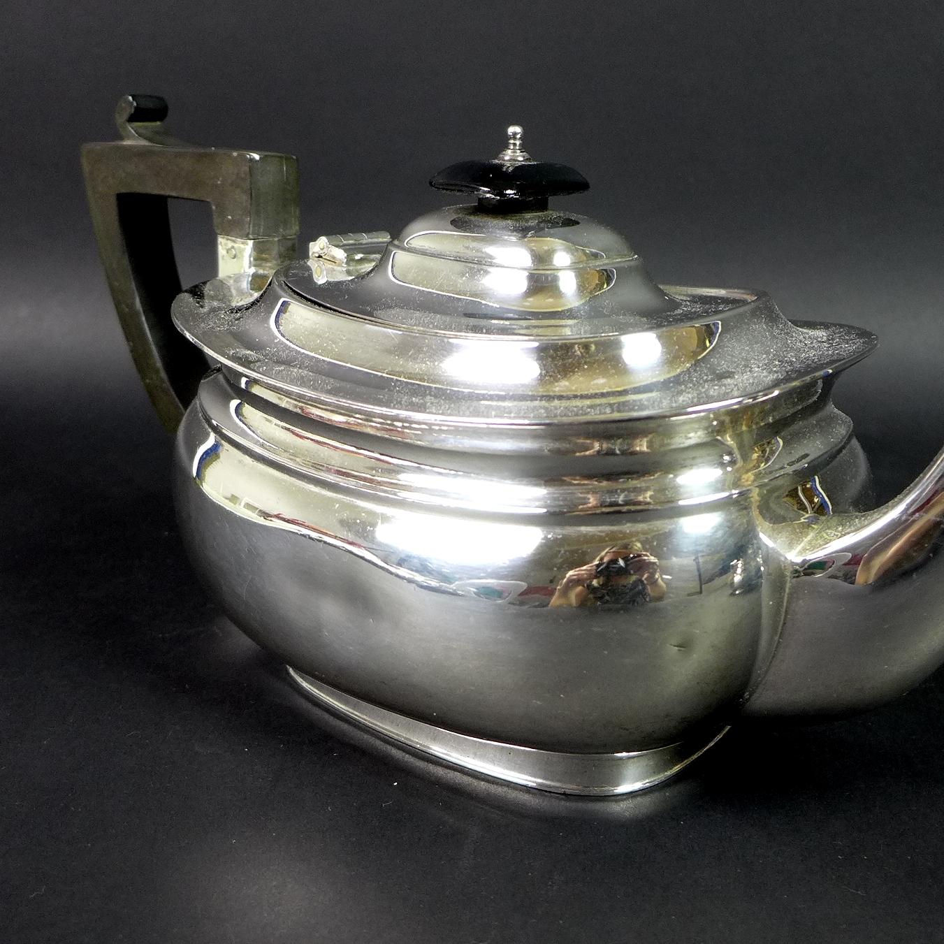 A George V silver three piece tea service, London shape, comprising teapot, twin handled sugar bowl, - Image 2 of 11