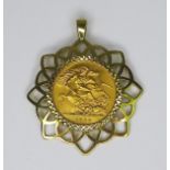 An Elizabeth II gold sovereign, 1959, in a 9ct gold pendant setting, 3.8cm, 12.2g total.