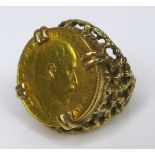 An Edward VII gold half sovereign, 1906, in a 9ct gold ring setting, size N, 10.5g total.