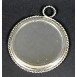 A mid 20th century Tiffany and Co hand mirror with rope twist rim, marked Sterling near handle, 7.