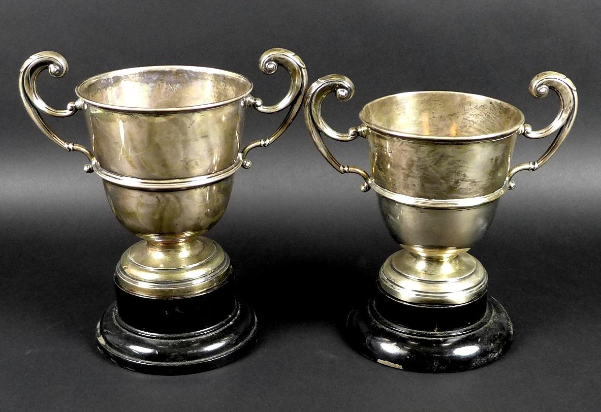 Two George V silver twin handled trophies, the first engraved 'Chertsey August Bank Holiday