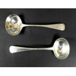 A pair of Victorian silver sauce ladles, Old English pattern, armorial engraved terminals,