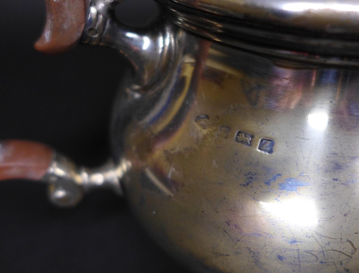 A George V silver teapot, of squat circular form, with ebonised handle and walnut finial, Adie Bros, - Image 6 of 9