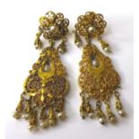 A pair of 1930s Indian 9ct gold earrings with seed pearl drops, very fine pierced decoration, each
