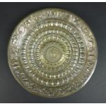 A 19th century Southern Indian silver dish, of circular form, with profuse repousse decoration