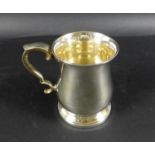 An Elizabeth II silver tankard, of baluster form, with rococo scroll handle and thumbpiece, Deakin &