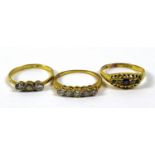A 18ct gold and diamond five stone ring, size K/L, together with two other 18ct gold rings, one with