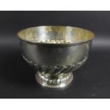 An Edwardian silver rose bowl, decorated with gadrooning interspersed with small circles,