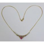 A 9ct gold ruby and illusion set diamond necklace, the pendant of winged heart design, 5.3cm wide,