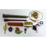 A group of jewellery and objects of vertu, comprising a cherry amber and gold mounted cigarette