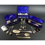 A group of silver items, comprising a Victorian berry spoon, Walker & Hall, Sheffield 1897, a