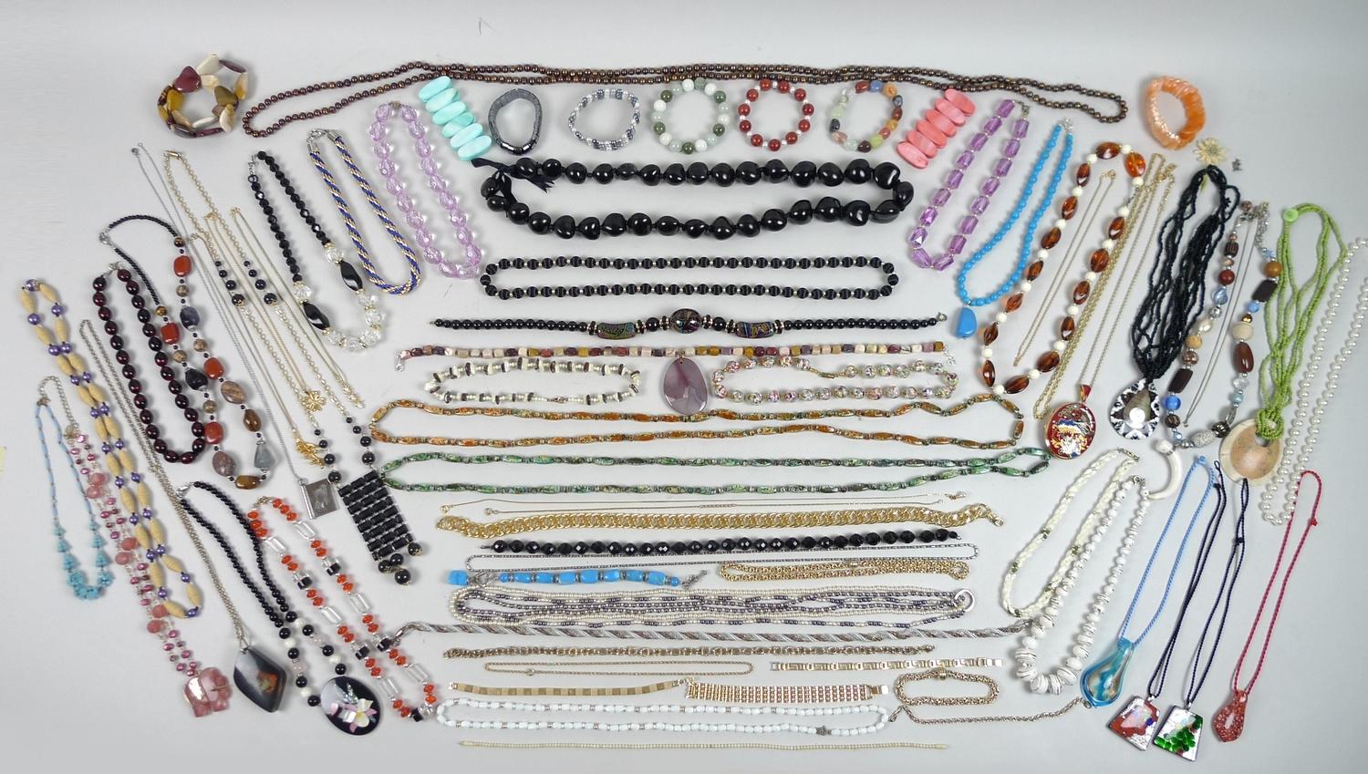A large quantity of costume jewellery, including various coloured beaded necklaces and bracelets,