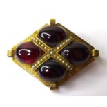 A Victorian garnet and seed pearl brooch, likely 15ct gold, the four cabouchon garnets each of