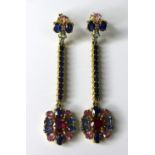 A pair of fancy sapphire, ruby and diamond drop earrings, 6.1cm long, 9.1g, with card certificate of