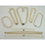 A group of cultured pearl and faux pearl necklaces, comprising a double strand, each 8mm, with