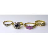 A group of three 18ct gold dress rings, comprising a sapphire and diamond cluster ring, size M, a