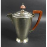 An Elizabeth II silver coffee pot, with stepped circular lid, bakelite handle and finial,