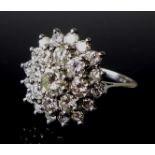 Private Collection-Vintage and Modern design rings: An 18ct white gold and diamond flowerhead