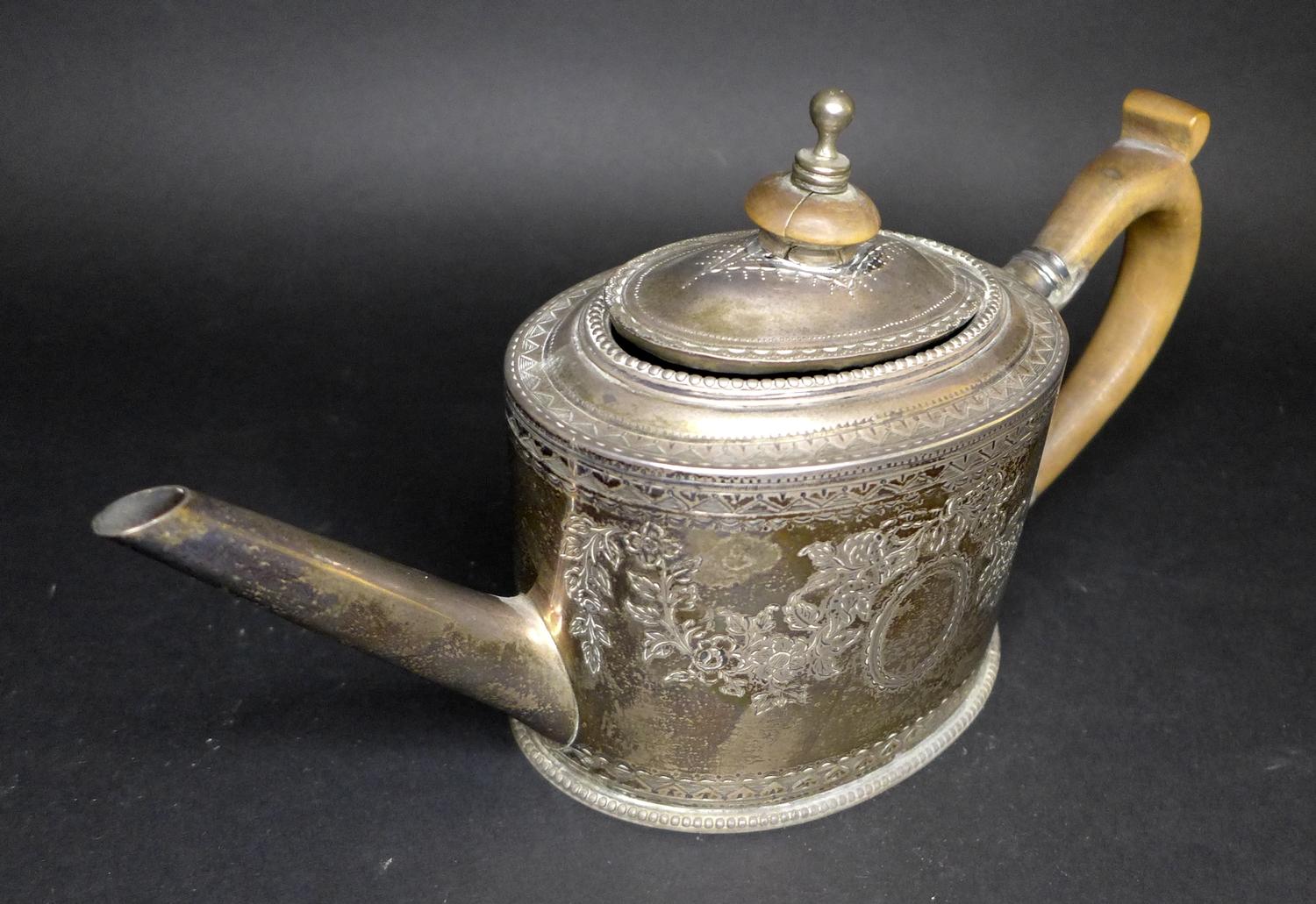 A George III silver teapot, decorated in Neoclassical taste with engraved swags and scrolls, - Image 4 of 7