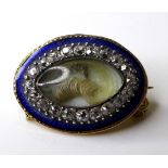 A mid 19th century 15ct gold mourning brooch of oval form, the central marquise surrounded by twenty