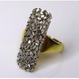 A diamond cluster ring inlaid with small baguette cut stones on an 18ct gold plated silver band,