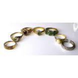 A group of six 9ct gold dress rings, including an emerald and diamond cluster ring, size O, and an