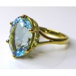 An 18ct gold and aquamarine solitaire ring, the pale blue aquamarine of approximately 4ct, 11.8 by