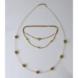 An 18ct gold necklace with delicate knot detailing, 4.5g, together with a decorative 9ct gold