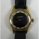 A vintage Nuclea De Luxe gold plated gentleman's wristwatch, with circular black dial, dot