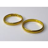 Two 22ct gold wedding bands, size M and size J, 4.9g total weight. (2)