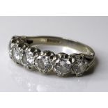 An 18ct white gold and diamond seven stone ring, each diamond approximately 0.3ct and 4mm