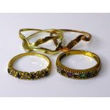 A group of three 9ct gold rings, comprising a Russian tri-gold wedding ring, a diamond and