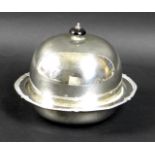 A George V silver muffin dish, of circular domed form, with black plastic finial, removable tray,