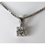 A 9ct white gold and diamond solitaire necklace, the brilliant cut stone of approximately 0.34ct,