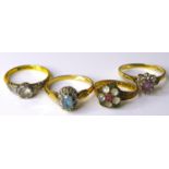 A group of four gold rings, including an Art Deco style 18ct gold and palladium ring, size N, 2.