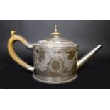 A George III silver teapot, decorated in Neoclassical taste with engraved swags and scrolls,